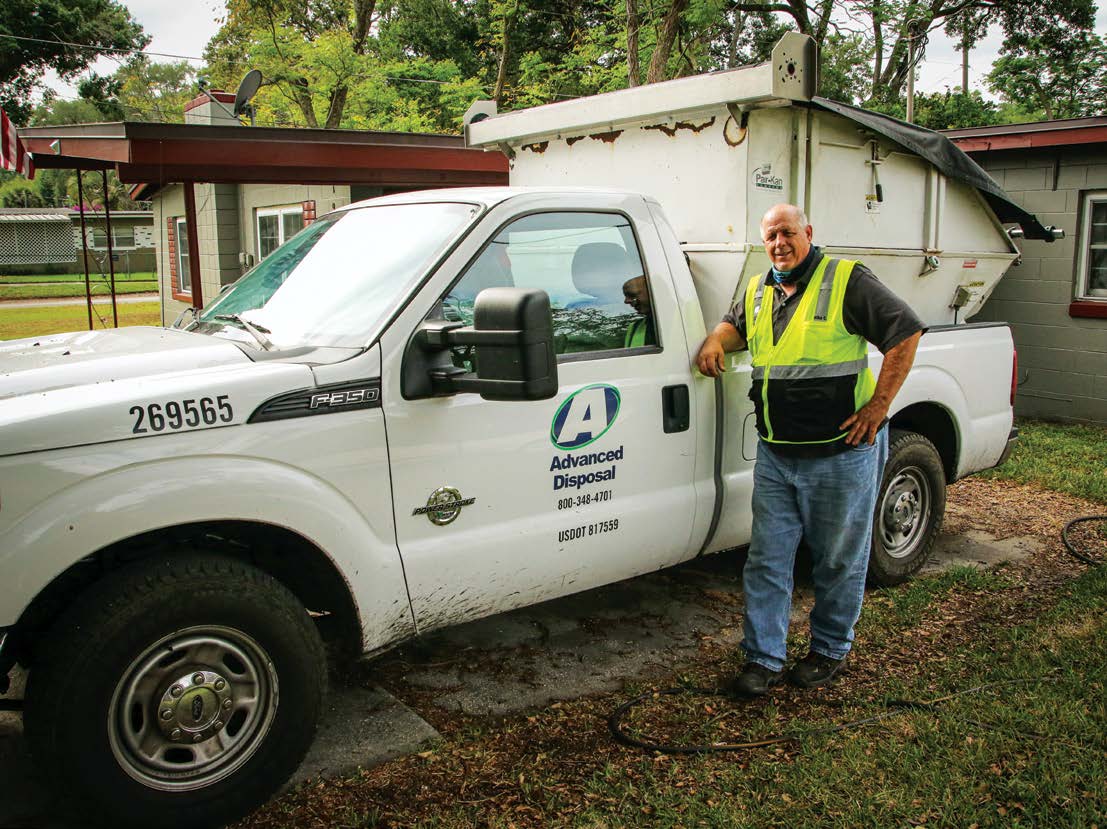 A man standing next to a truck