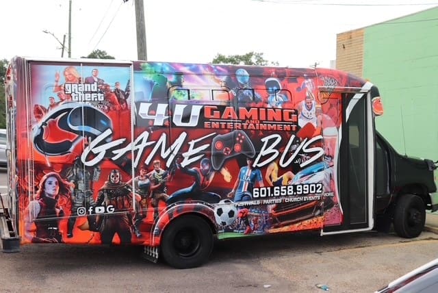 He bought a bus and began transforming it — installing multiple gaming systems, HDTVs, sound systems, and comfortable seating to create the ultimate mobile gaming experience.