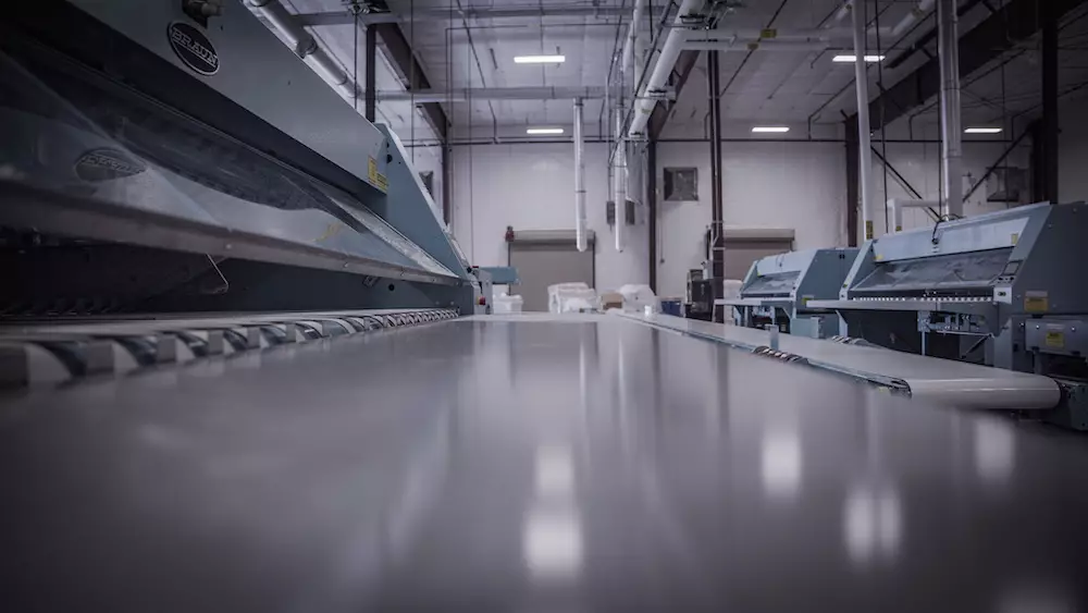 A conveyer belt that carries linen at North Heights Linen Service
